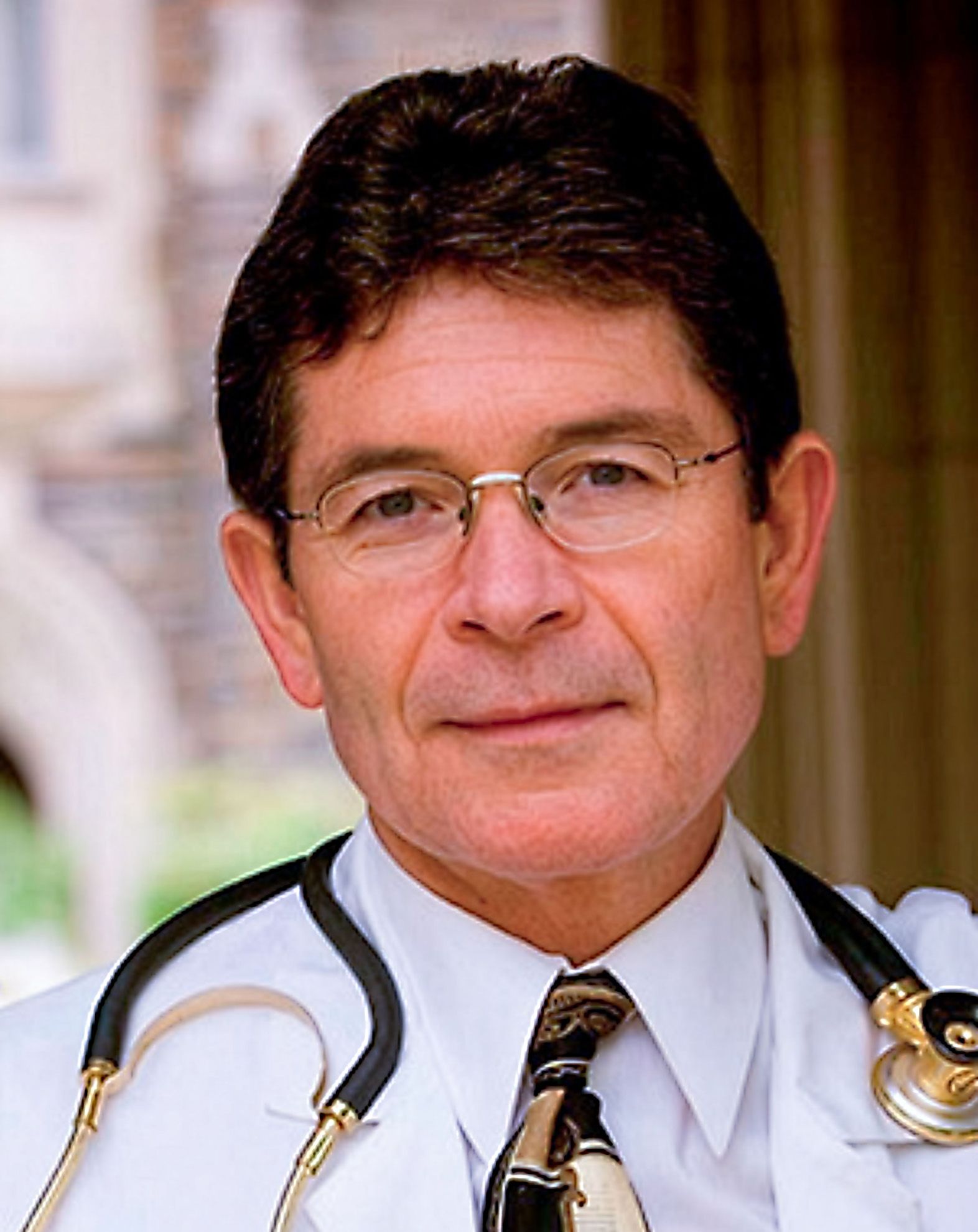 Dr. Harold Koenig, M.D. in a white lab coat