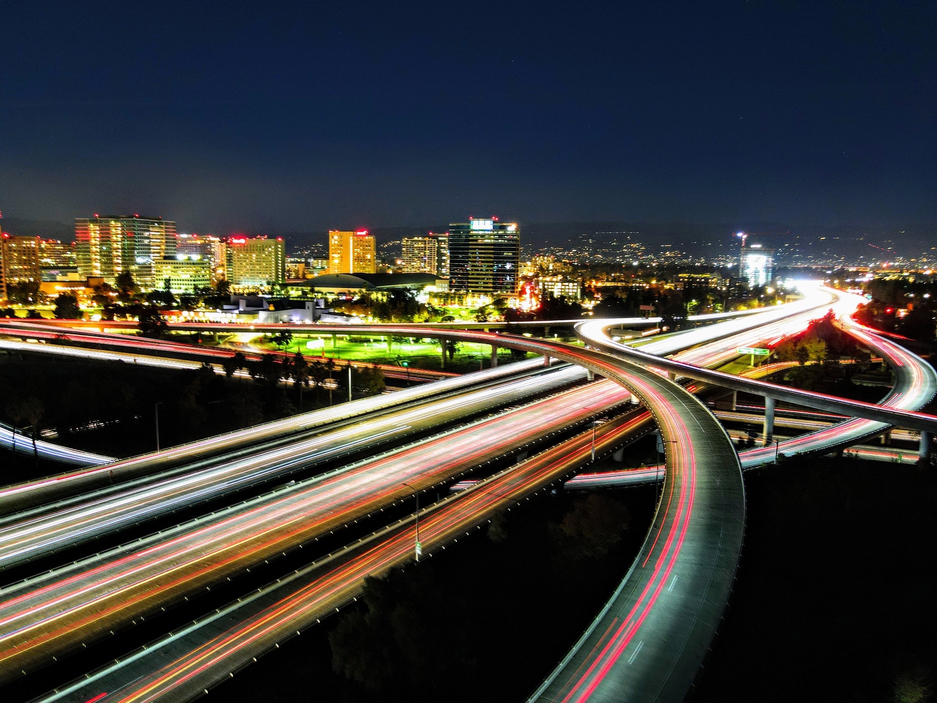 San Jose skyline at night with highway light trails